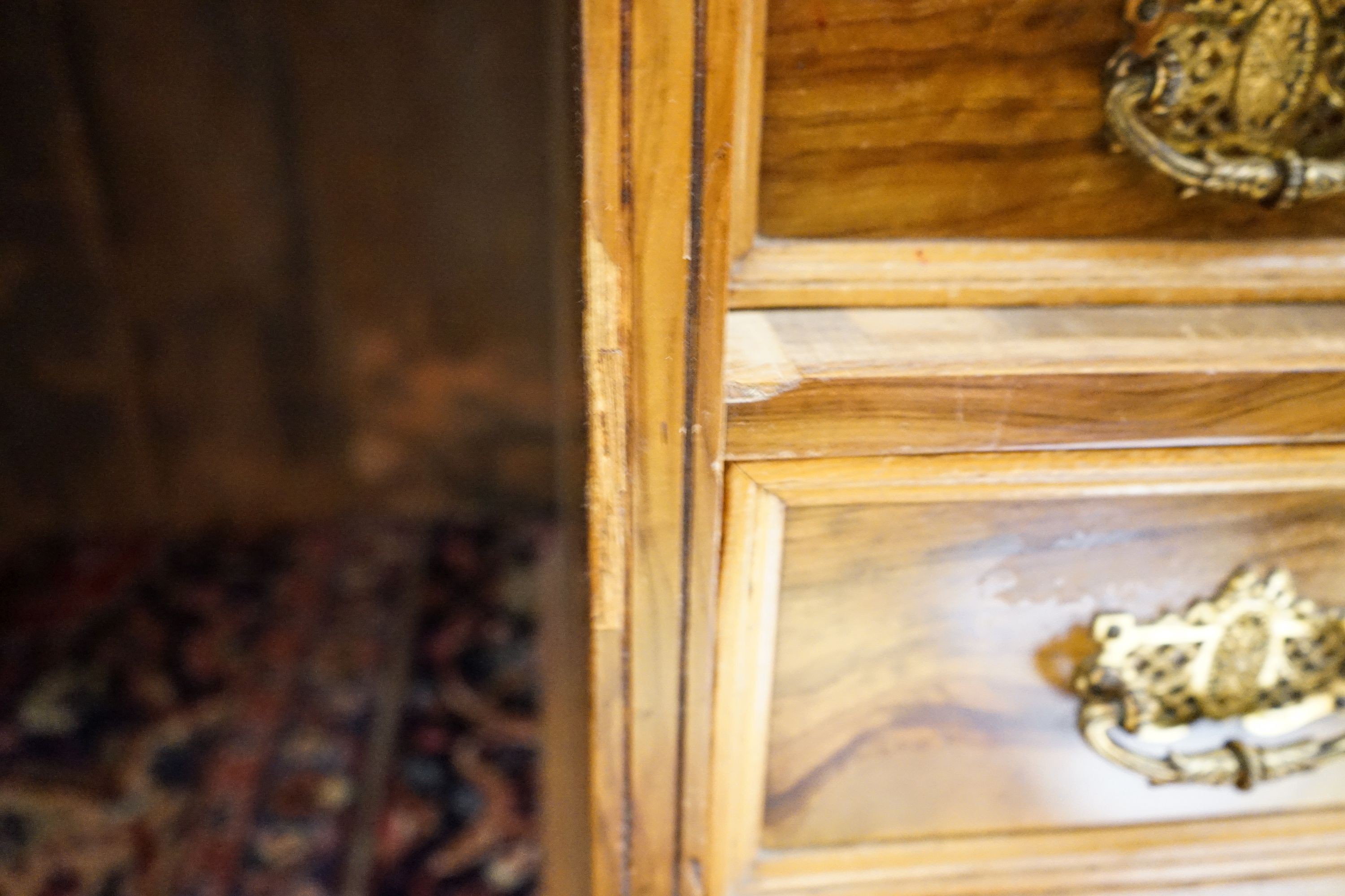 A late Victorian figured walnut twin pedestal desk, fitted with nine drawers with decorative gilt brass handles and plinth base, length 121cm, depth 60cm, height 75cm